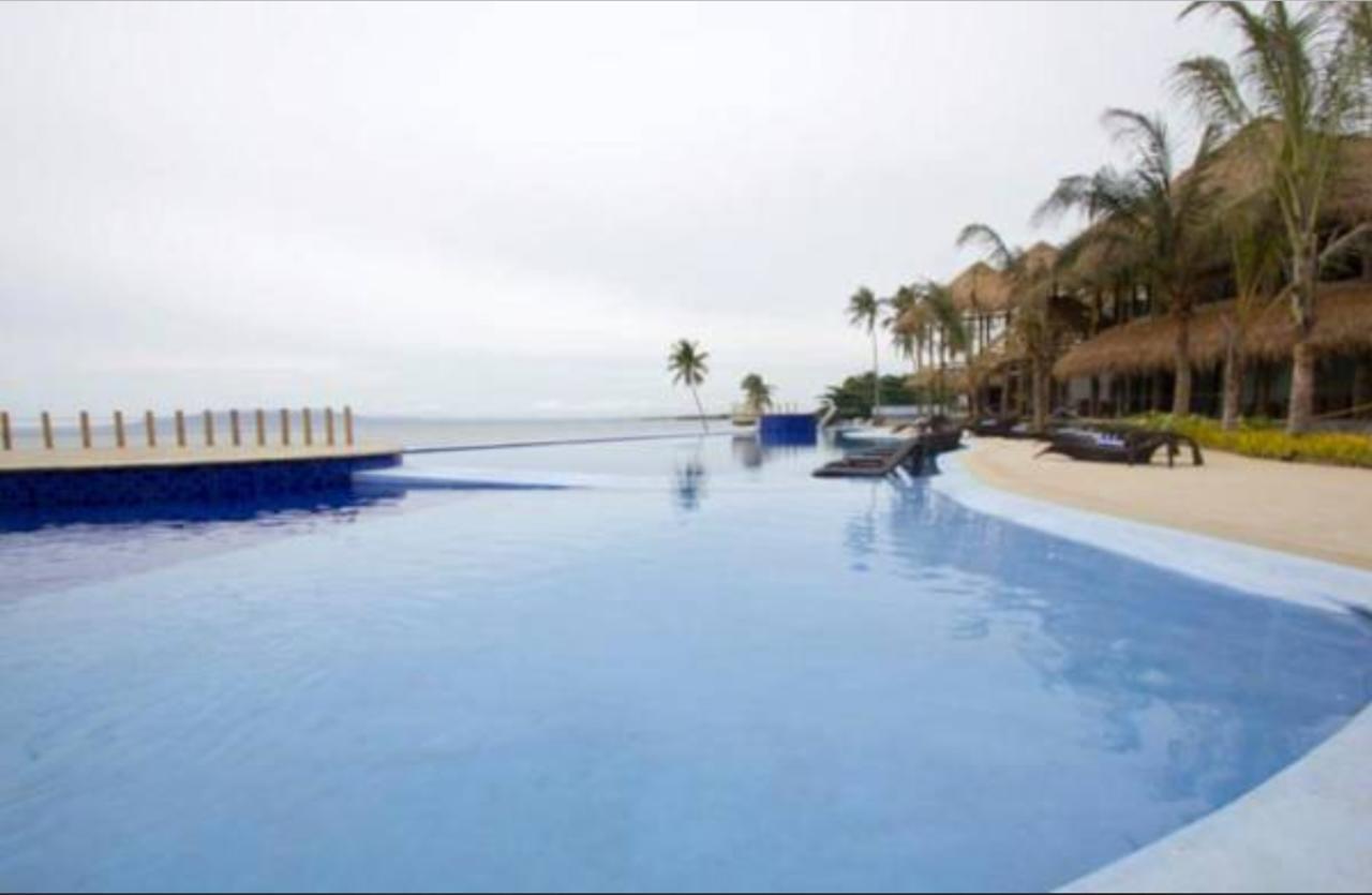 The Bellevue Resort Panglao Bagian luar foto Infinity pool at the Iberostar Grand Hotel, Playa del Carmen, Mexico